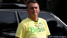 Brazilian President and re-election candidate Jair Bolsonaro looks on as he arrives to vote at a polling station in Rio de Janeiro, Brazil, on October 30, 2022, during the presidential run-off election. - After a bitterly divisive campaign and inconclusive first-round vote, Brazil elects its next president in a cliffhanger runoff between far-right incumbent Jair Bolsonaro and veteran leftist Luiz Inacio Lula da Silva. (Photo by MAURO PIMENTEL / AFP) (Photo by MAURO PIMENTEL/AFP via Getty Images)
