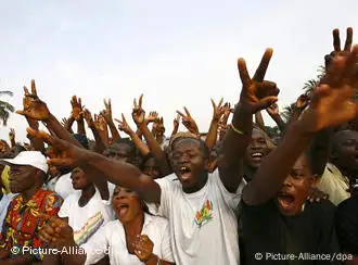 Pro government supporters gathered for a meeting by young patriots leader Charles Ble Goude in support of incumbent president Laurent Gbagbo in Abidjan, Ivory Coast 19 December 2010