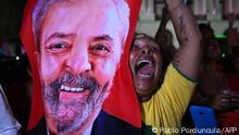 TOPSHOT - A supporter of Brazilian former President (2003-2010) and candidate for the leftist Workers Party (PT) Luiz Inacio Lula da Silva celebrates after her candidate won the presidential runoff election at the Cinelandia square in Rio de Janeiro, Brazil, on October 30, 2022. - Brazil's veteran leftist Luiz Inacio Lula da Silva was elected president Sunday by a hair's breadth, beating his far-right rival in a down-to-the-wire poll that split the country in two, election officials said. (Photo by Pablo PORCIUNCULA / AFP) (Photo by PABLO PORCIUNCULA/AFP via Getty Images)