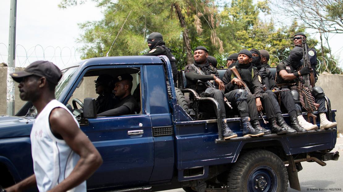 Policemen patrolling the streets in a pick-up truck