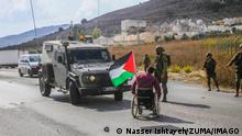  November 1, 2022, Nablus, West bank, Palestine: A Palestinian protester with special needs in a wheelchair confronts Israeli soldiers during a protest demanding Israel to reopen closed roads leading to Nablus, at the Hawara checkpoint near Nablus in West Bank. Nablus Palestine - ZUMAs197 20221101_zaa_s197_096 Copyright: xNasserxIshtayehx