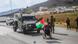A Palestinian in a wheelchair stands in front of an Israeli vehicle during protests A Palestinian in a wheelchair stands in front of an Israeli vehicle during protests