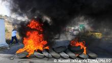  November 1, 2022, Nablus, West bank, Palestine: Palestinians protesters burn tiers and close the Main Street, during a protest demanding Israel to reopen closed roads leading to Nablus, at the Hawara checkpoint near Nablus in West Bank. Nablus Palestine - ZUMAs197 20221101_zaa_s197_091 Copyright: xNasserxIshtayehx
