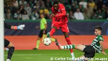 Frankfurt's French forward Randal Kolo Muani (C) scores a goal during the UEFA Champions League 1st round Group D football match between Sporting CP and Eintracht Frankfurt at the Jose Alvalade stadium in Lisbon on November 1, 2022. (Photo by CARLOS COSTA / AFP) (Photo by CARLOS COSTA/AFP via Getty Images)