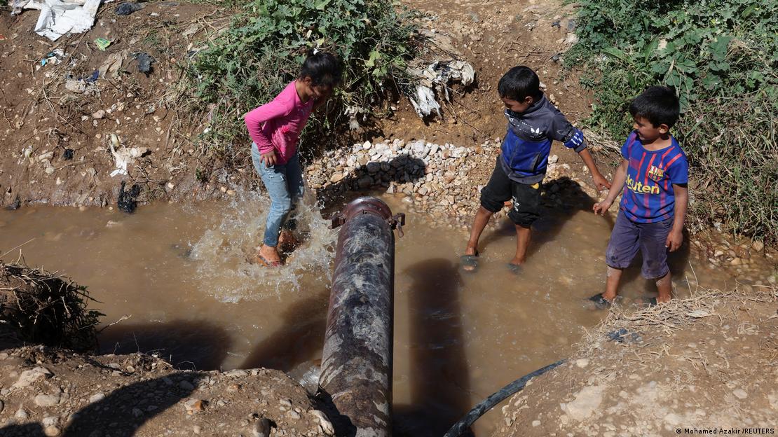 Children playing in muddy water