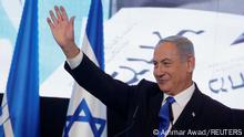 02.11.2022 +++ Likud party leader Benjamin Netanyahu waves as he addresses his supporters at his party headquarters during Israel's general election in Jerusalem, November 2, 2022. REUTERS/Ammar Awad
