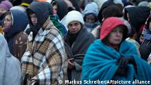 FILE - Refugees, mostly women and children, wait in a crowd for transportation after fleeing from the Ukraine and arriving at the border crossing in Medyka, Poland, on March 7, 2022. Russiaâ€™s invasion of Ukraine has driven some 14 million Ukrainians from their homes in â€œthe fastest, largest displacement witnessed in decades,â€ sparking an increase in the number of refugees and displaced people worldwide to more than 103 million, the U.N. refugee chief said Wednesday, Nov. 2, 2022. (AP Photo/Markus Schreiber, File)