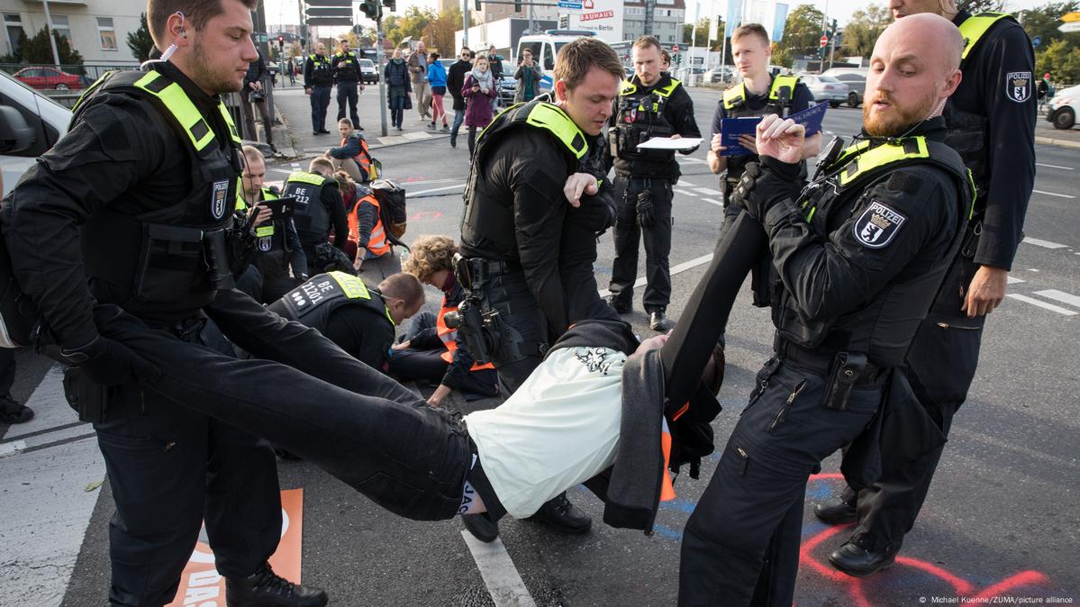 German police conduct raids on climate activists as impatience mounts