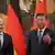 Olaf Scholz next to Xi Jinping with German and Chinese flags in the background