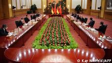 Chinese President Xi Jinping (3rd-L) talks with German Chancelor Olaf Scholz (3rd-R) at the Grand Hall in Beijing on November 4, 2022. (Photo by Kay Nietfeld / POOL / AFP)