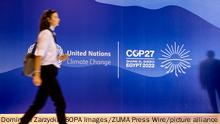 November 5, 2022, Sharm El Sheijk, South Sinai, Egypt: Participant walks in front of the UN COP27 logo as she arrives at the COP27 UN Climate Change Conference held by UNFCCC in Sharm El-Sheikh International Convention Center. COP27, running from November 6 to November 18 in Sharm El Sheikh focuses on implementation of measures already agreed during the previous COPs. The Conference in Sharm El Sheikh focuses also on the most vulnerable communities as the climate crisis hardens life conditions of those already most disadvantaged. (Credit Image: © Dominika Zarzycka/SOPA Images via ZUMA Press Wire