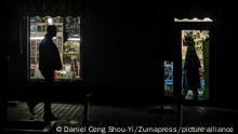November 2, 2022, Kyiv, Ukraine: People walking past a store in the dark as Kyiv has been darkened following government measures to control power demands. Many facilities such as street lights and elevators have been suspended while schedule blackouts are implemented to conduct electricity control, as Russian attacks on Ukraine have caused shortages in both water and electricity. (Credit Image: Â© Daniel Ceng Shou-Yi/ZUMA Press Wire