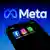 Facebook, Instagram and WhatsApp apps icons displayed on a smartphone backdropped by Meta Platforms logo