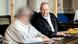 A midwife (her face pixellated to protect her identity) sits next to her lawyer, Thorsten Osterkamp in the regional "Landgericht Verden" court A midwife (her face pixellated to protect her identity) sits next to her lawyer, Thorsten Osterkamp in the regional "Landgericht Verden" court