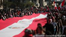 05.11.2022
People carry a Peruvian flag, during a protest against the government of Peru's President Pedro Castillo, in Lima, Peru November 5, 2022. REUTERS/Sebastian Castaneda