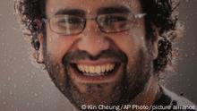 A photo of Egypt's leading pro-democracy activist Alaa Abdel-Fattah, is displayed outside the Foreign Office in London, Tuesday, Nov. 1, 2022. The family of Egypt's most prominent imprisoned activist says he began a full hunger strike on Tuesday and plans to stop drinking water as of Sunday, the first day of the global climate summit, or COP27, that Egypt is hosting this month. (AP Photo/Kin Cheung)