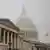 Fog envelopes the US Capitol dome behind the US House of Representatives