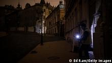 07.11.2022
KYIV, UKRAINE - NOVEMBER 07: A man plays a guitar on a dark, empty street on November 07, 2022 in Kyiv, Ukraine. Recent Russian attacks around Kyiv and across Ukraine have targeted power plants, killing civilians and employees of the key infrastructure. (Photo by Ed Ram/Getty Images)