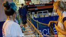 08.11.2022
Migrants disembark from the Norway-flagged Geo Barents rescue ship after having been allowed by Italian authorities, in Catania's port, Sicily, southern Italy, Tuesday, Nov. 8, 2022. While the Geo Barents was allowed to disembark all its migrants, the German-flagged Humanity1 is still at harbor in Catania with 35 aboard still waiting for permission, and another rescue ship, the Ocean Viking is appealing France for a safe port. (AP Photo/Massimo Di Nonno)