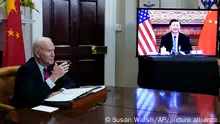 President Joe Biden meets virtually with Chinese President Xi Jinping from the Roosevelt Room of the White House in Washington, Monday, Nov. 15, 2021. (AP Photo/Susan Walsh)