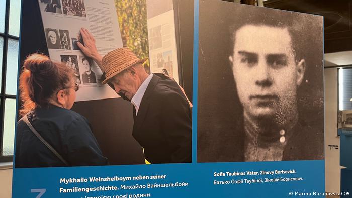 Left: Holocaust survivor Mykhailo Weinshelboym at the stand with the story of his family.  Right: Photo of Sofia Taubina's father
