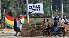 People block a street during an indefinite strike hold by unions opposing the government of Bolivian President Luis Arce to demand a census for 2023, in Santa Cruz, Bolivia, on October 24, 2022. (Photo by AIZAR RALDES / AFP) (Photo by AIZAR RALDES/AFP via Getty Images)