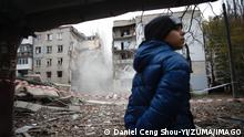 November 11, 2022, Mykolaiv, Mykolaiv, Ukraine: A Ukrainian boy reacts as a 5-storey residential building collapses after it was hit by a Russian S-300 missile, amid the Russian invasion of Ukraine. Following Moscow s announcement to retreat from Kherson, this attack on Mykolaiv was reported on 10 November local time, while Kyiv has been preparing for a whole-city evacuation as supplies of water and electricity are likely to suspend, Mykolaiv Ukraine - ZUMAs313 20221111_zip_s313_024 Copyright: xDanielxCengxShou-Yix 