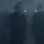 A still from series '1899': four people stand in a blueish fog.