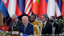 U.S. President Joe Biden, foreground, speaks during the ASEAN - U.S. summit in Phnom Penh, Cambodia, Saturday, Nov. 12, 2022. (AP Photo/Vincent Thian)