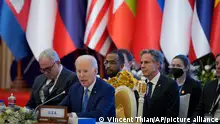 U.S. President Joe Biden, foreground, speaks during the ASEAN - U.S. summit in Phnom Penh, Cambodia, Saturday, Nov. 12, 2022. (AP Photo/Vincent Thian)