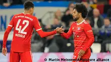 Bayern's Serge Gnabry, right, celebrates with Bayern's Jamal Musiala after he scored the opening goal during the German Bundesliga soccer match between FC Schalke 04 and Bayern Munich in Gelsenkirchen, Germany, Saturday, Nov. 12, 2022. (AP Photo/Martin Meissner)