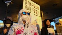 Demonstraten mit Masken in Berlin, 12.11. 2022.