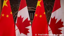 This picture taken on December 5, 2017, shows Canadian and Chinese flags taken prior to a meeting with Canada's Prime Minister Justin Trudeau and China's President Xi Jinping at the Diaoyutai State Guesthouse in Beijing. (Photo by Fred DUFOUR / POOL / AFP) (Photo by FRED DUFOUR/POOL/AFP via Getty Images)