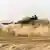 Leopard 2 tank seen among dust cloud