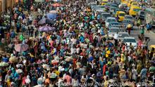 Lagos residents, despite social distancing order, cluster at Oke-Odo Market, Lagos Nigeria on Monday March 30, 2020 for last minute shopping. Federal Government has announced on Sunday, March 29, and declared total lockdown with effective from Monday 11pm in Lagos, Ogun State and Abuja, the nation capital, to tame the spread of coronavirus (COVID-19) pandemic. (Photo by Adekunle Ajayi/NurPhoto)