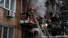 Firefighters work to put out a fire in a residential building hit by a Russian missile strike, amid Russia's attack on Ukraine, in Kyiv, Ukraine November 15, 2022. REUTERS/Gleb Garanich
