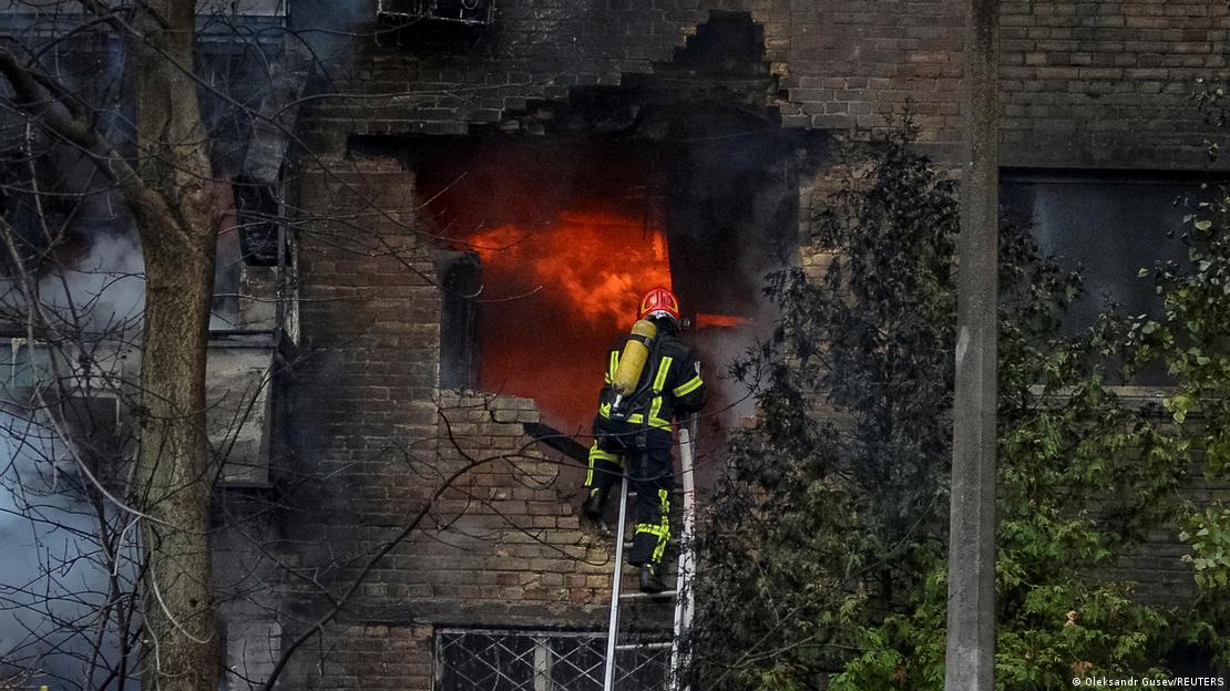 Firefighters in Kyiv work to put out a fire after a Russian missile struck a building.