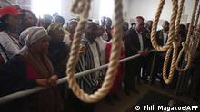 Families of the Pan Africanist Congress members (PAC) better known as the Krugersdorp 4 are taken through the gallows at Kgosi Mampuru Correctional Facility in Pretoria, South Africa on August 15, 2018. - PAC members better known as the Krugersdorp 4 who were hanged on 16 June 1964 for their participation in the killing of a security policeman in Krugersdorp. (Photo by Phill Magakoe / AFP)