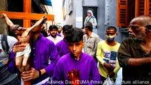 April 15, 2022, Kolkata, West Bengal, India: Christian youths and devotees seen carrying a cross outside of Missionaries of Charity as they take part in the religious procession during Good Friday . Good Friday is a Christian holiday commemorating the crucifixion of Jesus Christ and his death at Calvary. It is observed during Holy Week as part of the Paschal Triduum on the Friday preceding Easter Sunday, and may coincide with the Jewish observance of Passover. (Credit Image: © Avishek Das/SOPA Images via ZUMA Press Wire