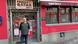 Peter Zimmermann, co-landlord of Cologne pub "Lotta", stands in front of a red building Peter Zimmermann, co-landlord of Cologne pub "Lotta", stands in front of a red building
