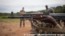 A FACA (Central African armed forces) recruit aims an AK-47s assault rifle during a shooting session at the Camp Leclerc base in Bouar, some six hundred kilometers northwest from the capital Bangui, on August 05, 2019. - The EUTM (European Union Training Mission) trains the Central African Armed Forces (Forces armees centrafricaines, FACA) at the rehabilitated Leclrec camp, a former French base that was handed over to the Central African State in 1997. (Photo by FLORENT VERGNES / AFP) (Photo by FLORENT VERGNES/AFP via Getty Images)