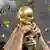 Hands holding up the World Cup trophy
