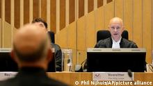 Presiding judge Hendrik Steenhuis speaks during the verdict session of the Malaysia Airlines Flight 17 trial at the high security court at Schiphol airport, near Amsterdam, Netherlands, Thursday, Nov. 17, 2022. The Hague District Court, sitting at a high-security courtroom at Schiphol Airport, is passing judgment on three Russians and a Ukrainian charged in the downing of Malaysia Airlines flight MH17 over Ukraine and the deaths of all 298 passengers and crew on board, against a backdrop of global geopolitical upheaval caused by Russia's full-blown invasion of Ukraine in February and the nearly nine-month war it triggered. (AP Photo/Phil Nijhuis)