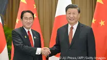 Japan's Prime Minister Fumio Kishida (L) shakes hands with China's President Xi Jinping during their meeting in Bangkok on November 17, 2022, on the sidelines of the Asia-Pacific Economic Cooperation (APEC) Summit. - Japan OUT (Photo by JAPAN POOL VIA JIJI PRESS / JAPAN POOL / JIJI PRESS / AFP) / Japan OUT (Photo by JAPAN POOL VIA JIJI PRESS/JAPAN POOL / JIJI PRESS/AFP via Getty Images)