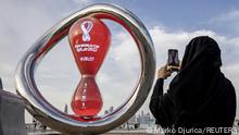 Soccer Football - FIFA World Cup Qatar 2022 Preview, Doha, Qatar - November 17, 2022
A fan takes a photograph of a countdown clock to the start of the World Cup REUTERS/Marko Djurica