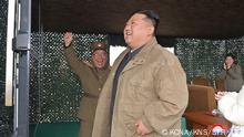 This picture taken on November 18, 2022 and released from North Korea's official Korean Central News Agency (KCNA) on November 19, 2022 shows North Korea's leader Kim Jong Un (C), with his wife Ri Sol Ju (back R), as they attend the test-firing of the new intercontinental ballistic missile (ICBM) Hwasong Gun 17 type at an undisclosed location in North Korea. - North Korean leader Kim Jong Un said he would respond to US threats with nuclear weapons, state media said on November 19, after Kim personally oversaw Pyongyang's latest launch of intercontinental ballistic missile. (Photo by KCNA VIA KNS / AFP) / South Korea OUT / REPUBLIC OF KOREA OUT
---EDITORS NOTE--- RESTRICTED TO EDITORIAL USE - MANDATORY CREDIT AFP PHOTO/KCNA VIA KNS - NO MARKETING NO ADVERTISING CAMPAIGNS - DISTRIBUTED AS A SERVICE TO CLIENTS / THIS PICTURE WAS MADE AVAILABLE BY A THIRD PARTY. AFP CAN NOT INDEPENDENTLY VERIFY THE AUTHENTICITY, LOCATION, DATE AND CONTENT OF THIS IMAGE --- / 