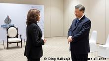 (221119) -- BANGKOK, Nov. 19, 2022 (Xinhua) -- Chinese President Xi Jinping has a brief exchange with U.S. Vice President Kamala Harris at the latter's request on the sidelines of the 29th Asia-Pacific Economic Cooperation (APEC) Economic Leaders' Meeting in Bangkok, Thailand, Nov. 19, 2022. (Xinhua/Ding Haitao)