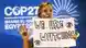 Eine Klimaaktivistin hält auf der Weltklimakonferenz COP27 in Scharm el-Scheich ein Plakat mit der Aufschrift "We are Watching"