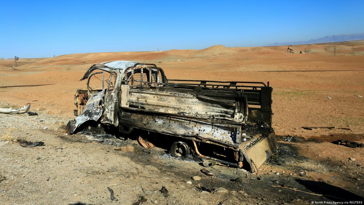 A burnt truck in the aftermath of airstrikes, which Turkey's defence ministry says it carried out, in Derik, Syria