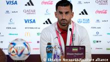 Iran's Ehsan Hajsafi speaks during a press conference at the World Cup press centre in Doha, Qatar, Sunday, Nov. 20,2022. (AP Photo/Ebrahim Noroozi)
